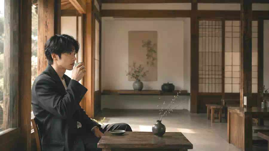 Decoding K-Drama Nonverbal Communication: The Art of the Unspoken 2 A character using Silent Storytelling in a quiet, traditional Korean setting