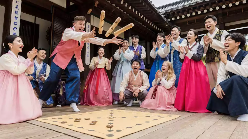 Seollal Guide: Ultimate Traditions, Food, and Etiquette for Korean Lunar New Year 5 Playing yutnori game on new year