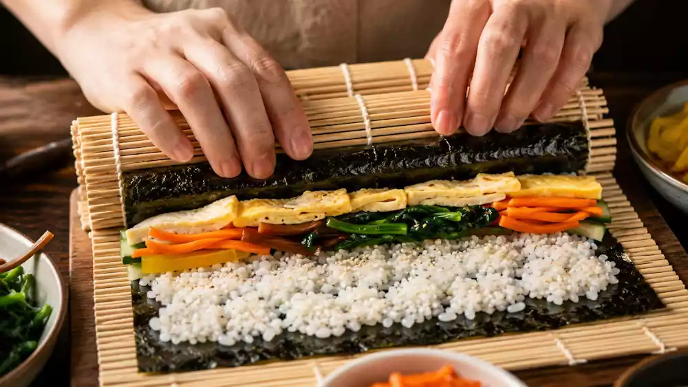 What is Gimbap? The Ultimate Guide to Korea’s Favorite Seaweed Rice Roll | 김밥 2 Rolling korean seaweed rice rolls