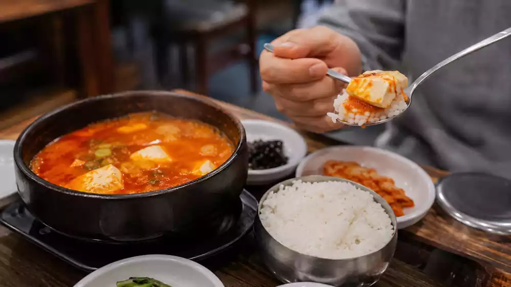 The Ultimate Guide to Sundubu Jjigae: Korea’s Famous Spicy Soft Tofu Stew | 순두부찌개 6 How to eat Sundubu Jjigae